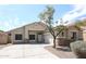 Beautiful one-story home showcasing a desert-style front yard and attached two-car garage, blending comfort with simplicity at 14262 N 142Nd Ln, Surprise, AZ 85379