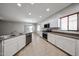 Modern kitchen featuring a stainless steel sink, appliances and bright white cabinets at 14262 N 142Nd Ln, Surprise, AZ 85379