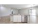 Kitchen island with sink and stainless steel dishwasher in an open floor plan at 14262 N 142Nd Ln, Surprise, AZ 85379