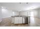 Kitchen island features a stainless steel dishwasher and double sink at 14262 N 142Nd Ln, Surprise, AZ 85379