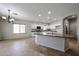 Stylish kitchen with stainless steel appliances, granite countertops, and a cozy breakfast nook at 14262 N 142Nd Ln, Surprise, AZ 85379