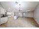 Large open-concept living space with tile flooring, connecting the kitchen and dining areas at 14262 N 142Nd Ln, Surprise, AZ 85379