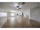 Expansive open-concept living area with tile floors, connecting the kitchen and dining spaces at 14262 N 142Nd Ln, Surprise, AZ 85379