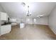 Well-lit living room with ceramic tile, ceiling fan, and open access to the kitchen, perfect for entertaining at 14262 N 142Nd Ln, Surprise, AZ 85379
