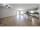 Bright, open-concept space featuring tile flooring and seamless flow into the kitchen, ideal for modern living at 14262 N 142Nd Ln, Surprise, AZ 85379