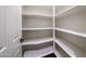 Walk-in pantry features multiple shelves at 14262 N 142Nd Ln, Surprise, AZ 85379