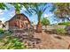 Expansive backyard with mature trees, providing shade and privacy for outdoor activities at 1451 E Brown Rd, Mesa, AZ 85203