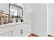 Bathroom vanity with a dark framed mirror and silver hardware at 1451 E Brown Rd, Mesa, AZ 85203