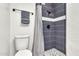 Bathroom featuring tiled shower and mosaic tile floor at 1451 E Brown Rd, Mesa, AZ 85203