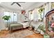 Bedroom with multiple plants and natural lighting at 1451 E Brown Rd, Mesa, AZ 85203