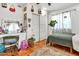 Bedroom with tiled floors, a plant and a vanity with a mirror at 1451 E Brown Rd, Mesa, AZ 85203