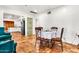 Inviting dining area with tile flooring near an open kitchen with modern appliances at 1451 E Brown Rd, Mesa, AZ 85203