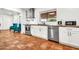 Well-lit kitchen with stainless steel appliances, butcher block counters, and a stainless steel dishwasher at 1451 E Brown Rd, Mesa, AZ 85203