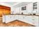 Bright kitchen with white cabinetry, butcher block countertops, and tiled flooring, creating a functional space at 1451 E Brown Rd, Mesa, AZ 85203