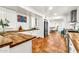 Updated kitchen features butcher block countertops, tiled flooring, and stainless steel appliances at 1451 E Brown Rd, Mesa, AZ 85203