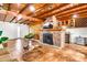 Charming living room featuring a brick fireplace, wood ceiling, and stylish decor creating a cozy atmosphere at 1451 E Brown Rd, Mesa, AZ 85203