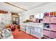 Bright workroom featuring neutral walls, tiled flooring, and multiple stations at 1451 E Brown Rd, Mesa, AZ 85203