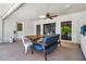 Inviting patio featuring a ceiling fan, skylight, and open design, perfect for outdoor gatherings at 1451 E Brown Rd, Mesa, AZ 85203