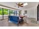 Relaxing patio with a ceiling fan and views of the lush backyard, ideal for outdoor enjoyment at 1451 E Brown Rd, Mesa, AZ 85203