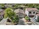 An aerial view of a well-maintained home featuring a two-car garage, landscaping, and a concrete driveway at 14793 W Surrey Dr, Surprise, AZ 85379