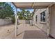 Spacious backyard with a gravel area, palm trees and a cozy seating area at 14793 W Surrey Dr, Surprise, AZ 85379