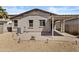 A backyard with a patio, drought-tolerant landscaping and lawn ornaments at 14793 W Surrey Dr, Surprise, AZ 85379