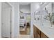Bright bathroom with double sinks that opens up into a bedroom at 14793 W Surrey Dr, Surprise, AZ 85379