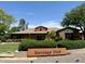 Community clubhouse exterior with well-manicured landscaping and signage at 14793 W Surrey Dr, Surprise, AZ 85379