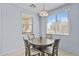 Cozy dining area with natural light and a round table with four chairs at 14793 W Surrey Dr, Surprise, AZ 85379