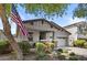 Attractive exterior view with a manicured lawn, small porch, and attached garage at 14793 W Surrey Dr, Surprise, AZ 85379
