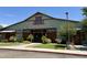 Charming exterior of a barn style building, featuring rustic wooden accents and well-maintained landscaping at 14793 W Surrey Dr, Surprise, AZ 85379