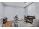 Flex space/office area with wood floors, a ceiling fan, and a large window for bright light at 14793 W Surrey Dr, Surprise, AZ 85379