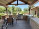 Outdoor grilling station with built-in barbecues, counter space, and comfortable seating at 14793 W Surrey Dr, Surprise, AZ 85379