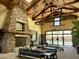 Grand lobby featuring a stone fireplace, high ceilings with wood beams, and comfortable seating area at 14793 W Surrey Dr, Surprise, AZ 85379