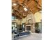 Spacious lobby with a stone fireplace, wood beam ceilings and comfortable seating at 14793 W Surrey Dr, Surprise, AZ 85379