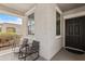 Inviting porch with chairs for relaxing, offering a pleasant outdoor living space at 14793 W Surrey Dr, Surprise, AZ 85379