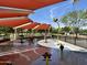 Community splash pad with colorful water features and shaded seating areas at 14793 W Surrey Dr, Surprise, AZ 85379