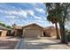Charming single-Gathering home with a two-car garage and low maintenance desert landscaping under blue sky at 15025 W Bottle Tree Ave, Surprise, AZ 85374