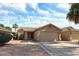 Charming single-Gathering home with a two-car garage and low maintenance desert landscaping under blue sky at 15025 W Bottle Tree Ave, Surprise, AZ 85374
