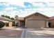 Charming single-Gathering home with a two-car garage and low maintenance desert landscaping under blue sky at 15025 W Bottle Tree Ave, Surprise, AZ 85374