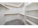 Organized walk-in closet with shelving and hanging rods for ample storage at 15025 W Bottle Tree Ave, Surprise, AZ 85374