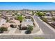 Home featuring solar panels is located on a well maintained street with views of a mountain in the distance at 1563 E Racine Dr, Casa Grande, AZ 85122