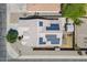 Aerial view of home featuring solar panels, desert landscaping and an enclosed backyard at 1563 E Racine Dr, Casa Grande, AZ 85122