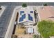 This home features solar panels, desert landscaping, an enclosed patio, and a storage shed at 1563 E Racine Dr, Casa Grande, AZ 85122