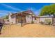 Well maintained backyard featuring a pergola, spacious area for entertaining, and a shed for extra storage at 1563 E Racine Dr, Casa Grande, AZ 85122