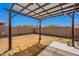 Backyard with a covered patio, xeriscaping and walled perimeter for privacy at 1563 E Racine Dr, Casa Grande, AZ 85122
