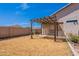 Private backyard space with covered patio, ideal for outdoor dining and enjoying warm days at 1563 E Racine Dr, Casa Grande, AZ 85122