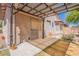 Covered patio area extends from the home, offering shade with low-maintenance backyard and wall at 1563 E Racine Dr, Casa Grande, AZ 85122