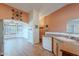 The spacious kitchen features light oak cabinets, corian countertops, and stainless appliances at 1563 E Racine Dr, Casa Grande, AZ 85122