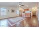 Inviting living room and kitchen area, featuring hardwood floors and vaulted ceilings at 1563 E Racine Dr, Casa Grande, AZ 85122